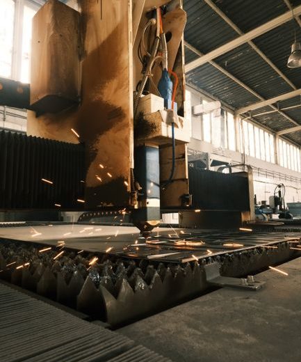 High-tech laser cutter operating in a modern industrial environment.